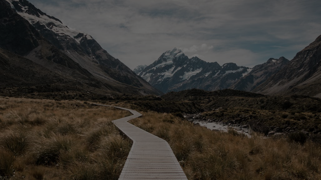A foggy mountain trail fading into the distance, symbolizing the courage to move forward without knowing exactly where the path leads
